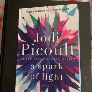 Paperback copy of “A Spark of Light” by Jodi Picoult. Excellent condition.